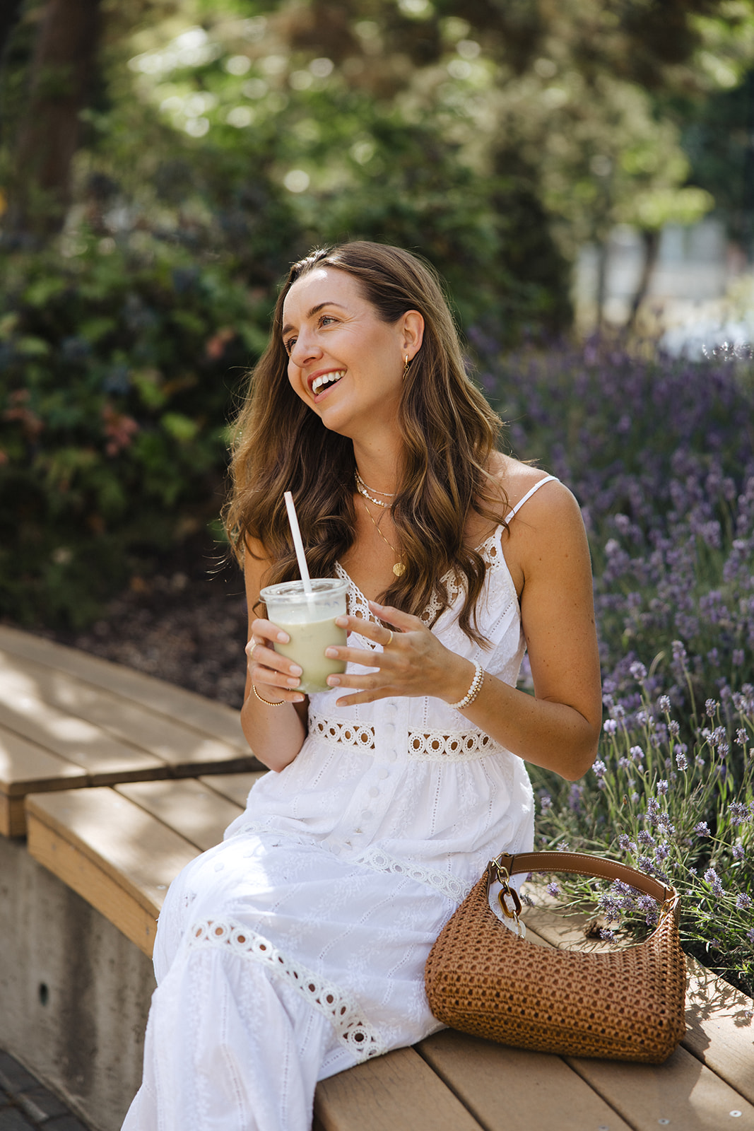 Robyn Clark sitting outside with a matcha, smiling