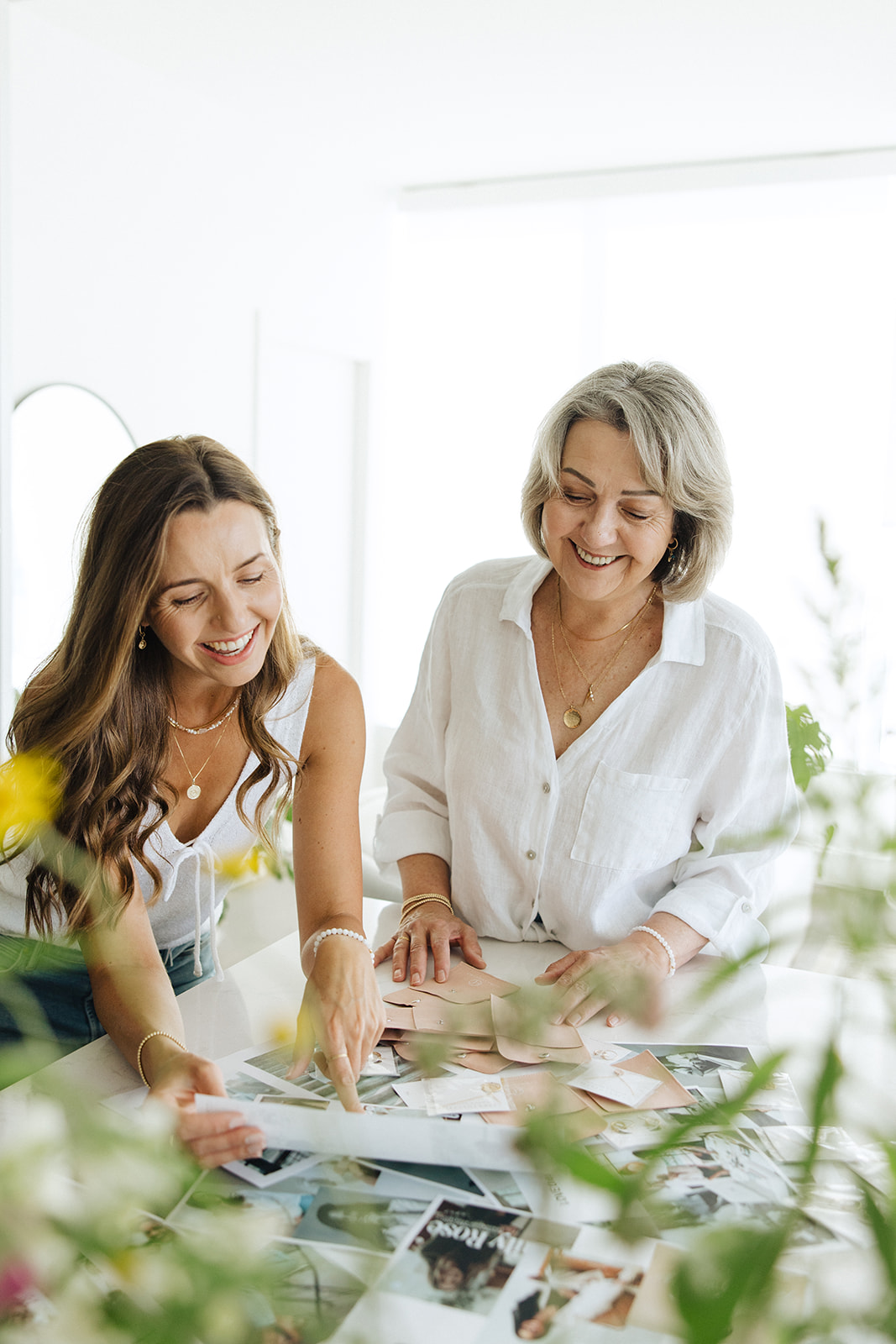 Desiré and Robyn reviewing jewelry designs together